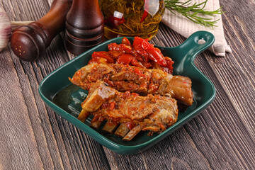 Baked lamb ribs with vegetables