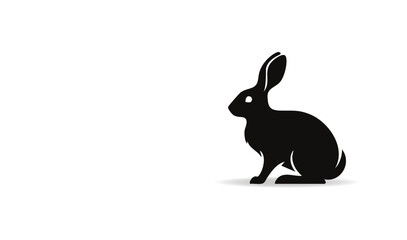Obraz premium Black silhouette of a rabbit sitting on white background with shadow effect