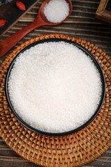 Yunnan sugarcane edible sugar in a rustic bowl on a woven mat captured during a market display