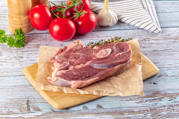 Raw lamb steak with bone