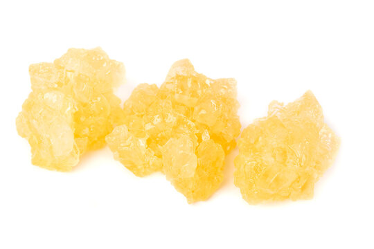 Handmade yellow rock candy made from sugar cane using ancient methods for a delightful treat