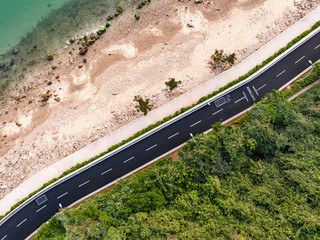 asphalt road side by sea
