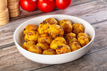 Baked small baby potato with herbs