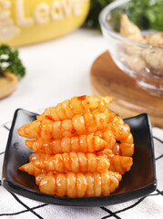 Freshly dug red oil ground ring screw vegetables served with crisp ganoderma on a stylish plate