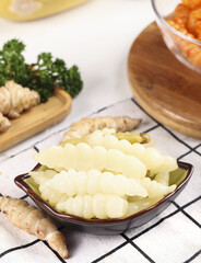 Exploring unique flavors with freshly dug pickled pepper ground silkworms for a nutritious lunch option in a vibrant kitchen