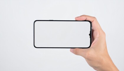 Hand holding smartphone with blank screen