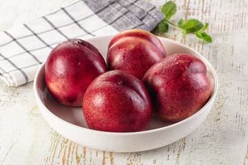 Ripe sweet juicy nectarines heap