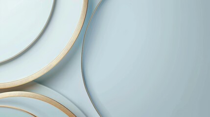 A minimalist arrangement of plates with gold rims on a soft blue background.