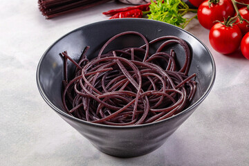 Boiled black rice noodles spaghetti