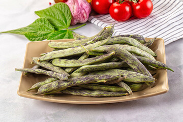 Raw green bean strips heap