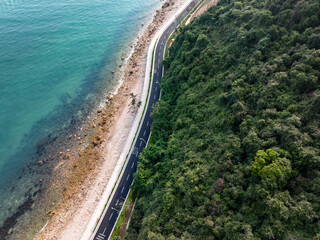 asphalt road side by sea
