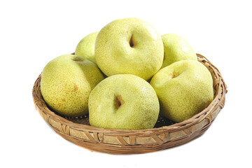 Fresh white crown pears arranged attractively in a woven basket on a bright white background