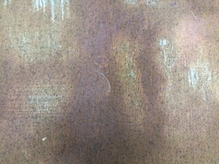 Grungy Rusted Metal Surface Texture. Close-up of a rusted metal surface with weathered textures,...