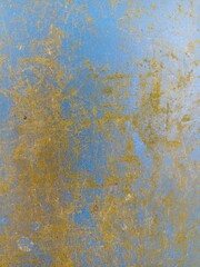 Aged Blue Surface with Yellow Stains and Scratches. Grunge texture of a worn blue surface with yellow stains and random scratches, perfect for use in abstract backgrounds or design overlays