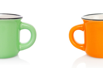 Two empties  porcelain half  coffee cups close up isolated on white background