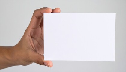 Hand holding blank white card