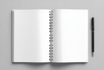 Top View of Open Spiral Notebook with Blank Pages and Pen on Gray Background

