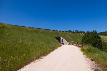 Biker driving through a tunnel on the George S. Mickelson Trail, South Dakota