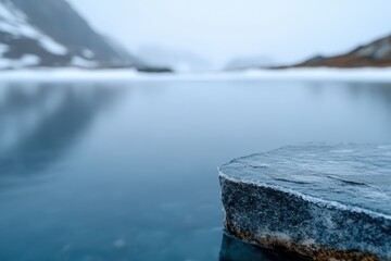 Icy rock juts out into a glacial lake in the Swiss Alps