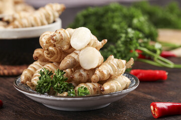 Fresh meal featuring gourami and pagoda cress stoneworms prepared with vibrant herbs and spices in...