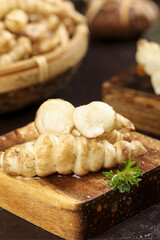 Fresh bullock screw vegetables displayed on a wooden board with intricate presentation and vibrant ingredients