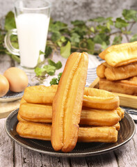 Making crispy fritters in the early morning with fresh ingredients and a side of milk