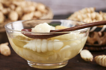 Fresh pickled paulownia ganja groundworms prepared for culinary exploration in a rustic kitchen setting