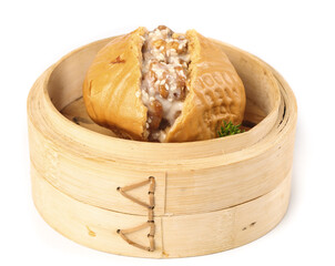 Delightful walnut buns filled with brown sugar served in a bamboo steamer during a Cantonese...