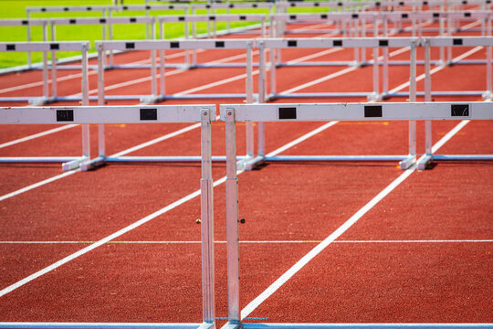 hurdles on a empty race track in stadium
