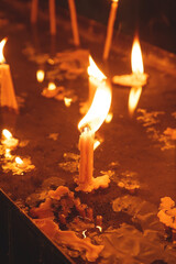Burning candles in a church.