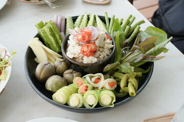 Mackerel chili paste Fresh vegetable salad with avocado and cucumber in a bowl