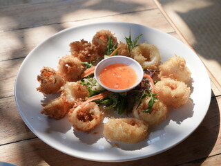 Spicy Thai Crispy fried squid and seafood fried dishes with assorted vegetables