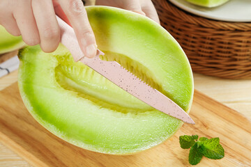 Shandong shallow bottom jade mushroom melon is freshly cut and prepared for serving in a cozy...