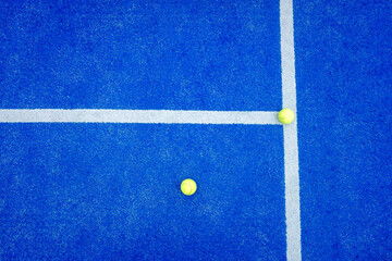 Clean and simple composition on a blue artificial turf court.