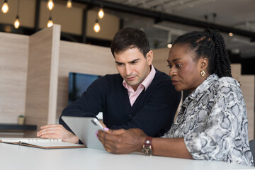 Team of diverse businessman and businesswoman discuss and working, brainstorming together with...