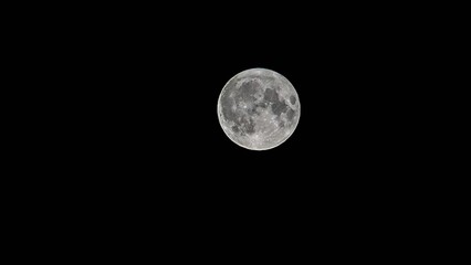 Fototapeta premium Panoramic photo of a full Moon on a black background