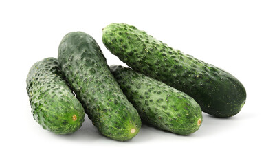 Many fresh green cucumbers isolated on white