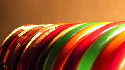 Array of colorful fashion bangles in a bright ambience