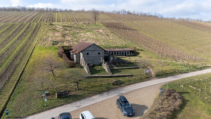 Aerial View of Rustic Farmhouse and Vineyards