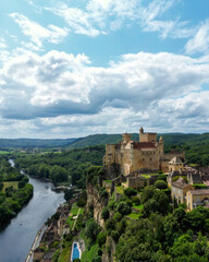 The Château de Beynac, a castle in the commune of Beynac-et-Cazenac, perched on top of a limestone...