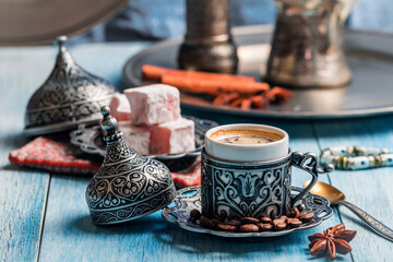Turkish coffee and turkish delight with traditional embossed metal tray and cup