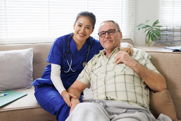 Nurse and patient looking at the camera and smiling.