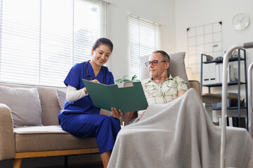 Portrait of nurse and her senior man client, senior man listening to counseling caregiver.
