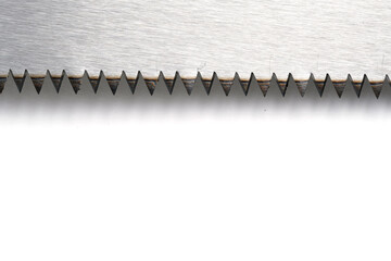 Metal saw blade on white background with copy space for text or image.