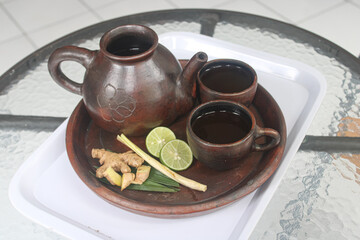 Traditional Indonesian Herbal Tea Set with Ginger, Lemongrass, and Lime