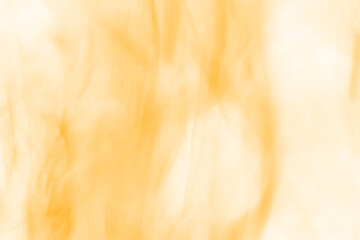 Abstract close up of vibrant orange and yellow flames showcasing the dynamic and energetic movement...