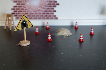 A Miniature construction scene with a pile of sand and traffic cones for the julenisse in denmark