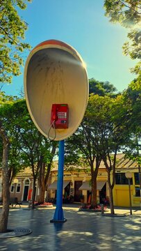 Giant Public Telephone Sculpture in Urban Brazilian Square