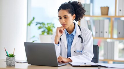 Doctor working on laptop in office - Powered by Adobe