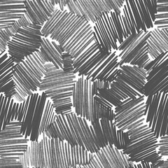Seamless pattern with gray graphite pencil hatching. Black and white hand drawn texture. Chaotic scribbles. Background with hatching in different directions